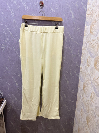 Ivory ribbed flare pants – product view