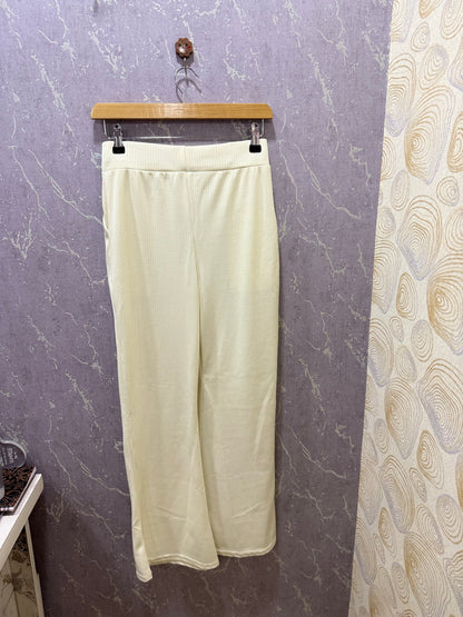 Off-white ribbed flare pants – product view