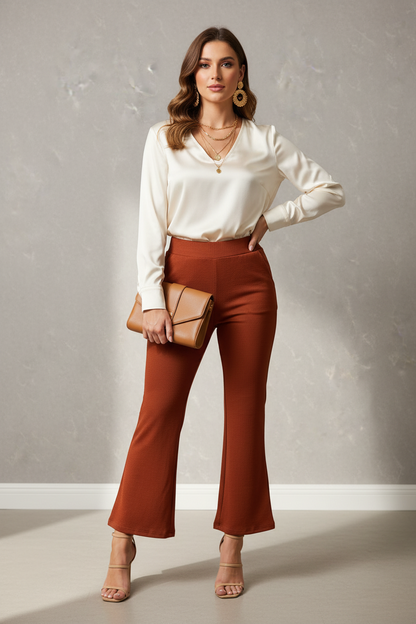 Model wearing rust ribbed flare pants by A 'n' A