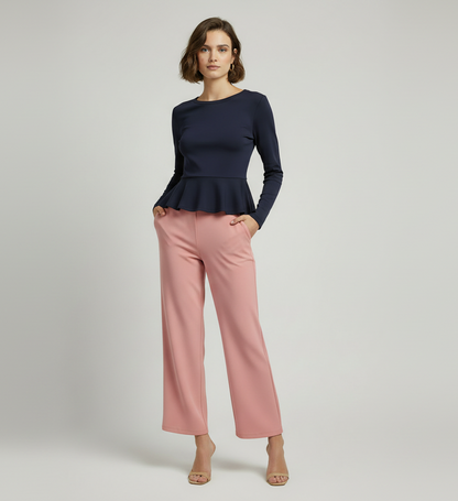 Model wearing nude pink ribbed flare pants by A 'n' A
