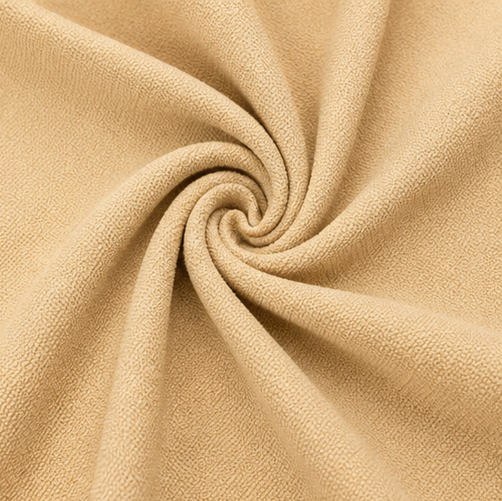 Close-up of the beige Italian Crepe fabric with a fine textured finish